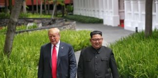 Liberace and Kim Jong Un walking in the park.